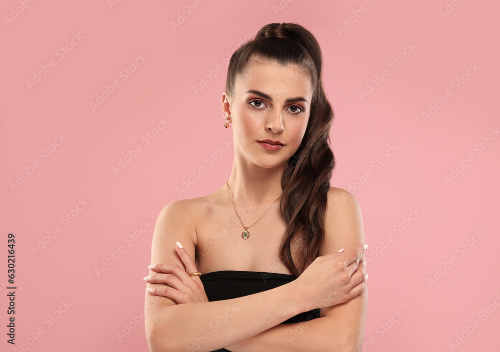 Beautiful woman with elegant jewelry on pink background Beautiful woman with elegant jewelry on pink background