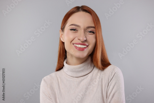 Portrait of beautiful young woman on light gray background © New Africa