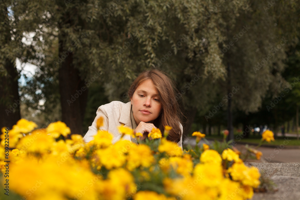 Cute woman with yellow flowers outdoor Cute woman with yellow flowers outdoor