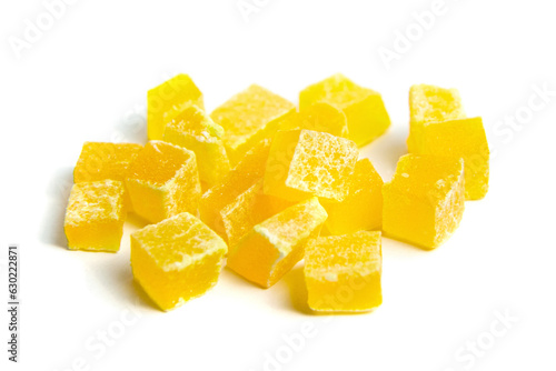 Diced mango dried fruits isolated on white background. Dehydrated mango chips dices