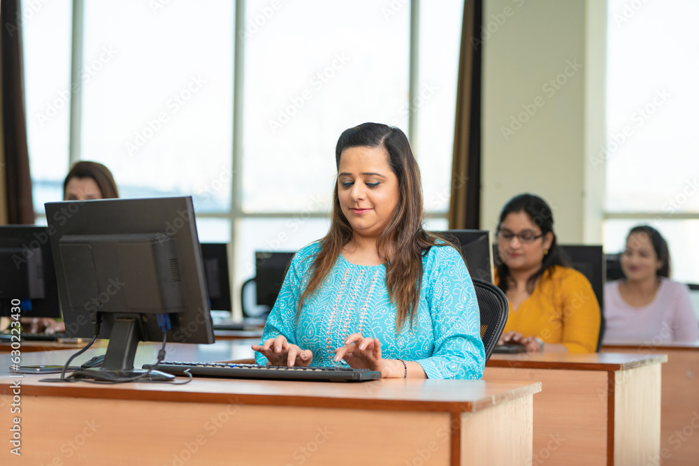 Indian woman working on computer at office. Indian woman working on computer at office.