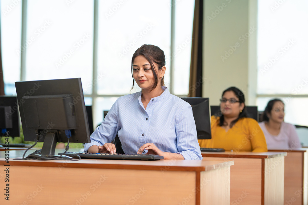 Indian woman working on computer at office. Indian woman working on computer at office.