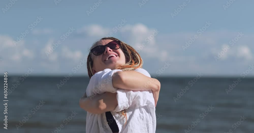 Happy relaxed woman breathing fresh air raising arms over blue sky at summer, Dreaming, freedom and traveling concept. Happy relaxed woman breathing fresh air raising arms over blue sky at summer, Dreaming, freedom and traveling concept.