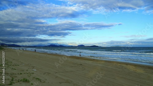 Haitang bay time lapse at dusk by the sea. Haitang Bay, located in Sanya, Hainan Province, is a famous resort bay in China. photo