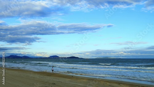 Haitang bay time lapse at dusk by the sea. Haitang Bay, located in Sanya, Hainan Province, is a famous resort bay in China. photo