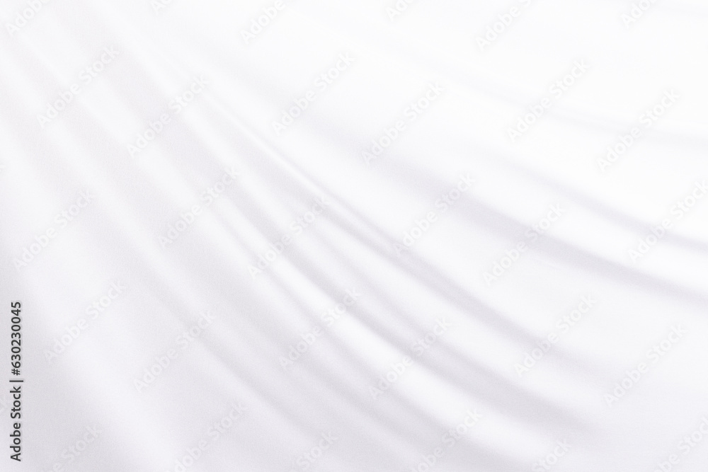 Close up of white shiny silk fabric with copy space background