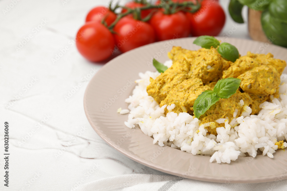 Delicious rice and chicken with curry sauce on white textured table, closeup. Space for text Delicious rice and chicken with curry sauce on white textured table, closeup. Space for text