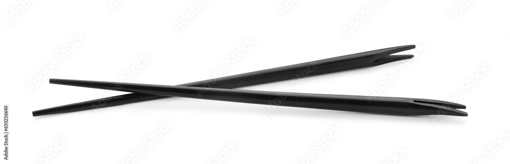 Pair of black chopsticks isolated on white Pair of black chopsticks isolated on white