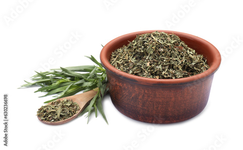 Bowl of dry tarragon, spoon and fresh leaves isolated on white