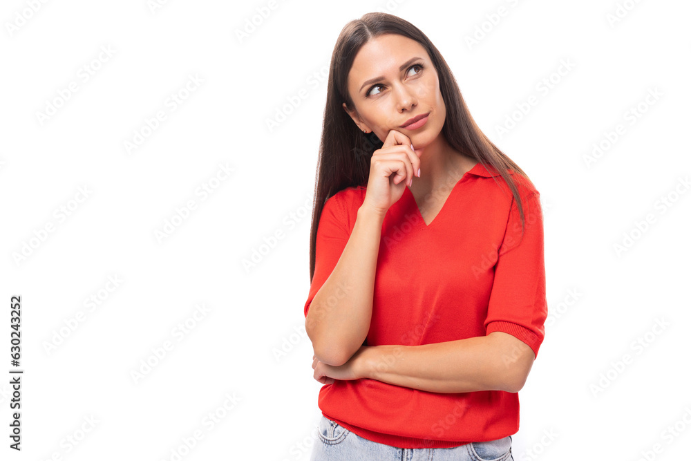 young smiling european woman with dark straight hair dressed in a red short sleeve shirt on a white background with copy space young smiling european woman with dark straight hair dressed in a red short sleeve shirt on a white background with copy space