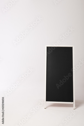 Black sign in white frame and copy space on white background