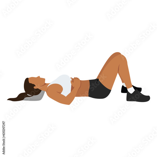 Woman doing semi supine laying down or constructive rest position exercise.
