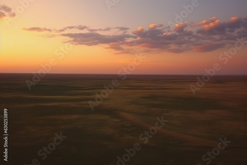 Flight over the evening steppe in sunset colors.