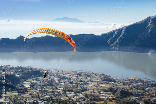 Paraglider in the sky. The sportsman flying on a paraglider.