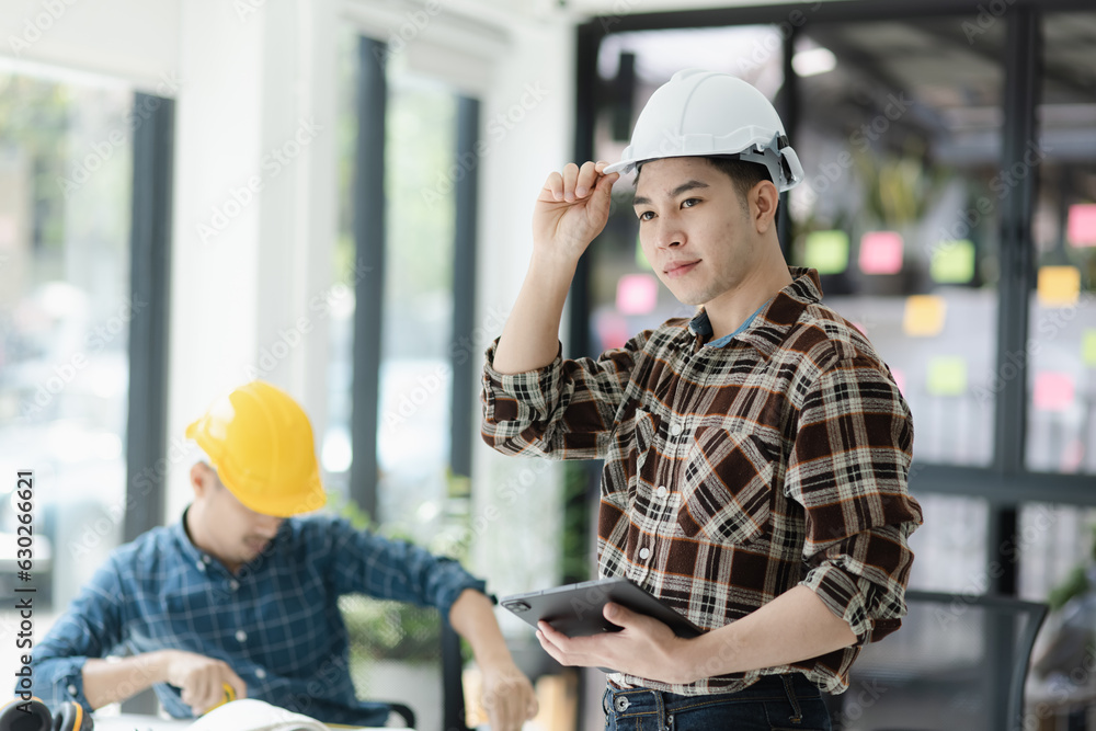 Asian engineer team and architects working designing planing of project, Home renovation concept. Asian engineer team and architects working designing planing of project, Home renovation concept.