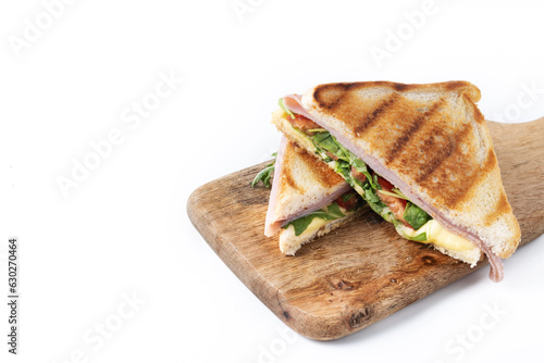 Panini sandwich with ham, cheese, tomato and arugula isolated on white background. Copy space