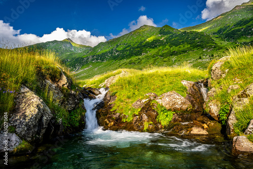 Summer landscape of the Fagaras Mountains, Romania. A view from the hiking trail near the Balea Lake and the Transfagarasan Road. photo