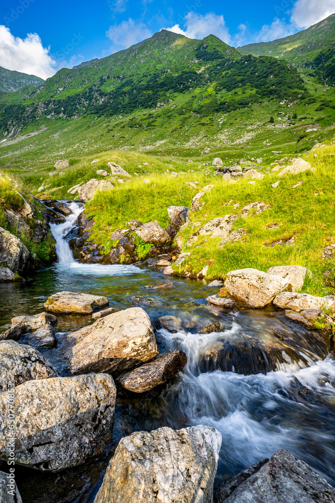 Summer landscape of the Fagaras Mountains, Romania. A view from the hiking trail near the Balea Lake and the Transfagarasan Road. Summer landscape of the Fagaras Mountains, Romania. A view from the hiking trail near the Balea Lake and the Transfagarasan Road.