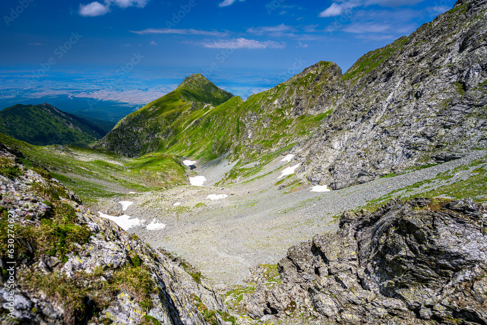 Summer landscape of the Fagaras Mountains, Romania. A view from the hiking trail near the Balea Lake and the Transfagarasan Road.