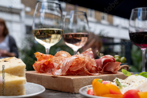 Canvas Print Appetising platters of caprese mozzarella cheese and tomatoes, and salami meat, photographed at a deli in King Street, Covent Garden, London UK