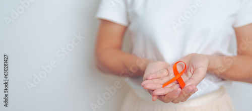 Fotografie woman with Orange Ribbon for Leukemia, Kidney cancer day, world Multiple Sclerosis, CRPS, Self Injury Awareness month