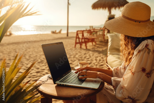 Woman working with laptop computer at the beach. Working while travelling. Generative AI