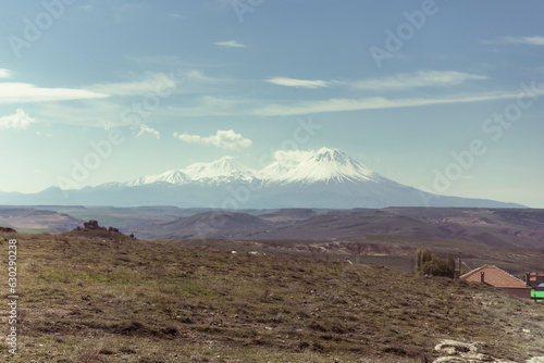 View of Mount Hasandagi, a Mountain Peak and inactive volcano with snow on the top in wintertime, Aksaray, Turkey. photo