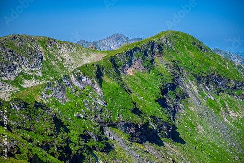 The Mount Paltinul. Summer landscape of the Fagaras Mountains, Romania. A view from the hiking trail near the Balea Lake and the Transfagarasan Road. photo