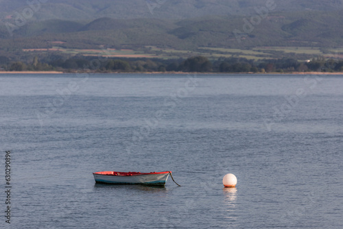 View of a fishing boat along Volvi Lake in Mikri Volvi small town, Central Macedonia, Greece. photo