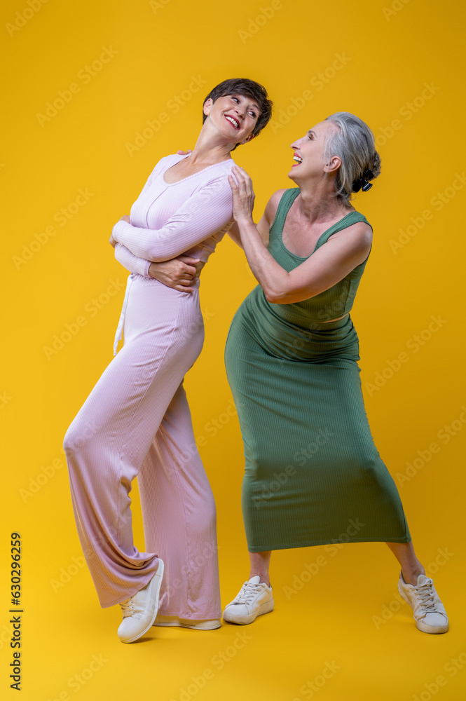 Two good-looking senior women feeling excited Two good-looking senior women feeling excited
