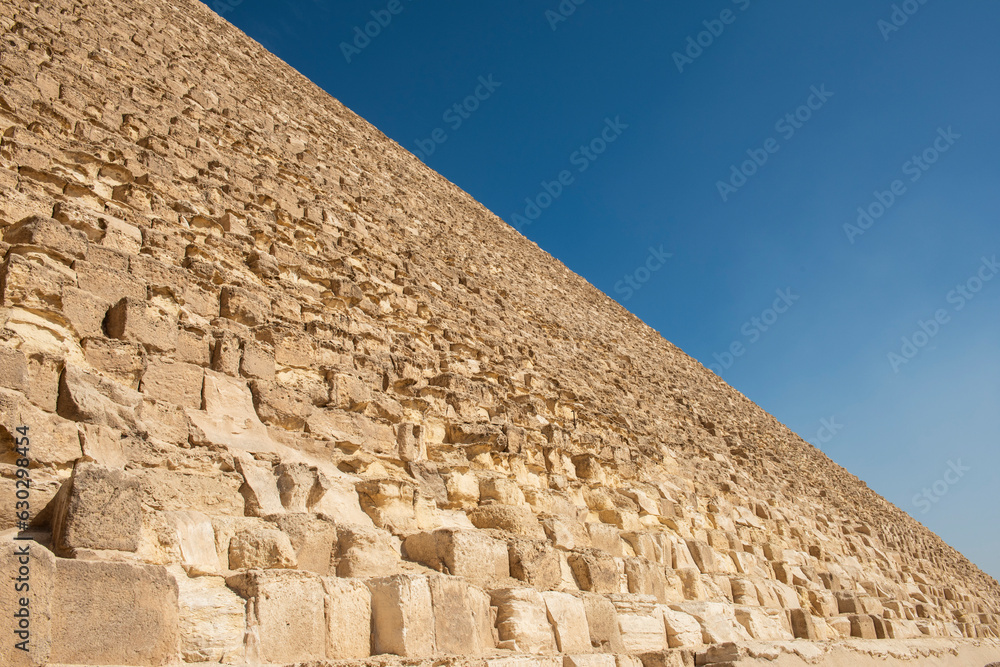 Abstract view of ancient stone pyramid side wall Abstract view of ancient stone pyramid side wall