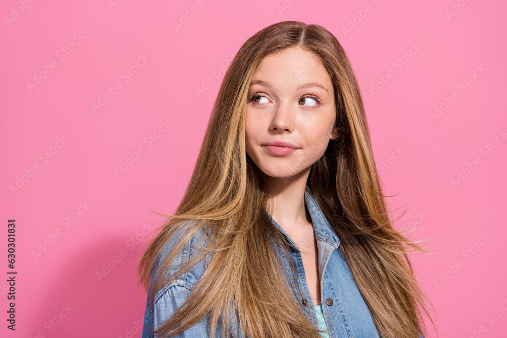 Portrait of cute pretty charming girl wear stylish clothes looking empty space seasonal offer news isolated on pink color background Portrait of cute pretty charming girl wear stylish clothes looking empty space seasonal offer news isolated on pink color background