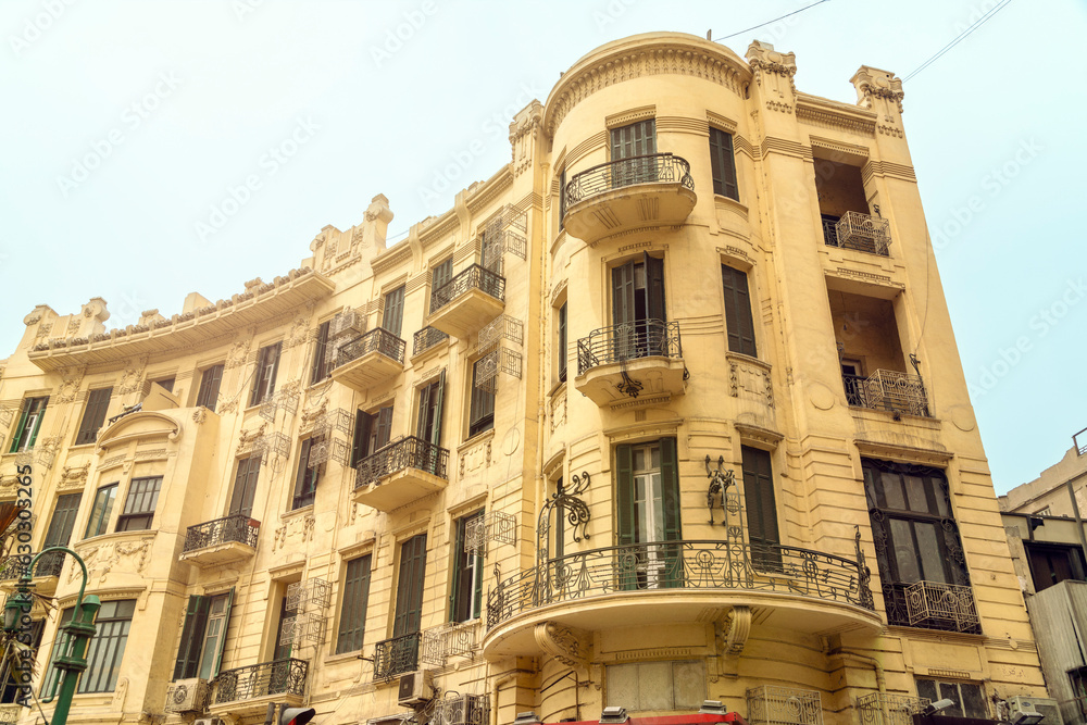 Historic houses in European colonial style in Talaat Harb Square near Tahrir Square, downtown, in Cairo, Egypt Historic houses in European colonial style in Talaat Harb Square near Tahrir Square, downtown, in Cairo, Egypt