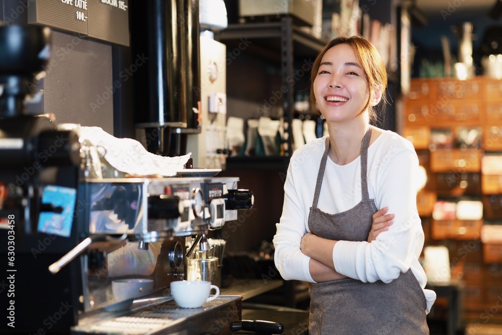 Cheerful woman making a coffee cup in cafe,Barista holding a cup of hot coffee for the first Morning. Cheerful woman making a coffee cup in cafe,Barista holding a cup of hot coffee for the first Morning.