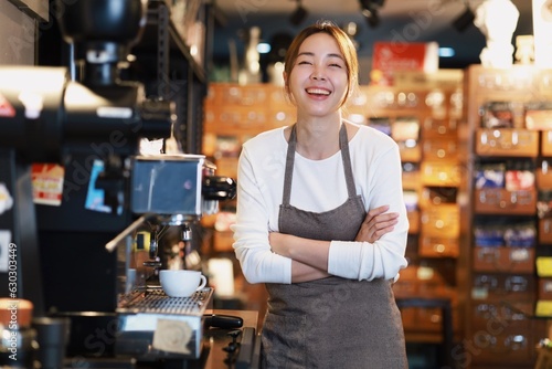 Cheerful woman making a coffee cup in cafe Barista holding a cup of hot coffee for the first Morning.