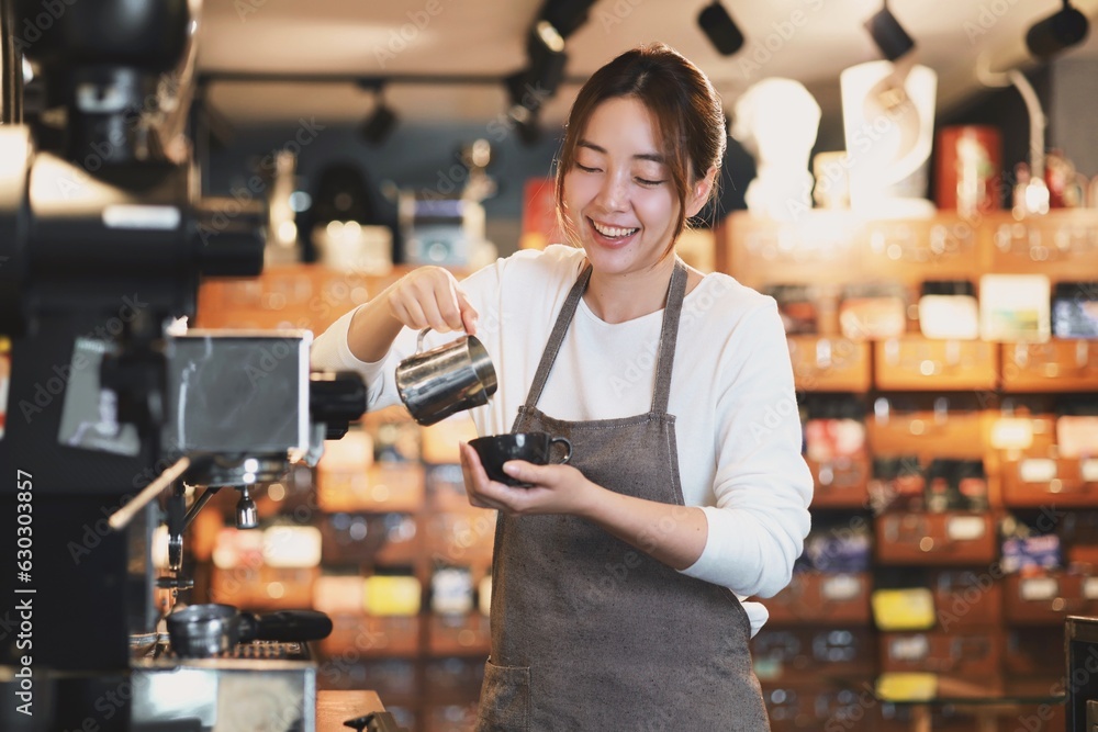 Cheerful woman making a coffee cup in cafe,Barista holding a cup of hot coffee for the first Morning. Cheerful woman making a coffee cup in cafe,Barista holding a cup of hot coffee for the first Morning.