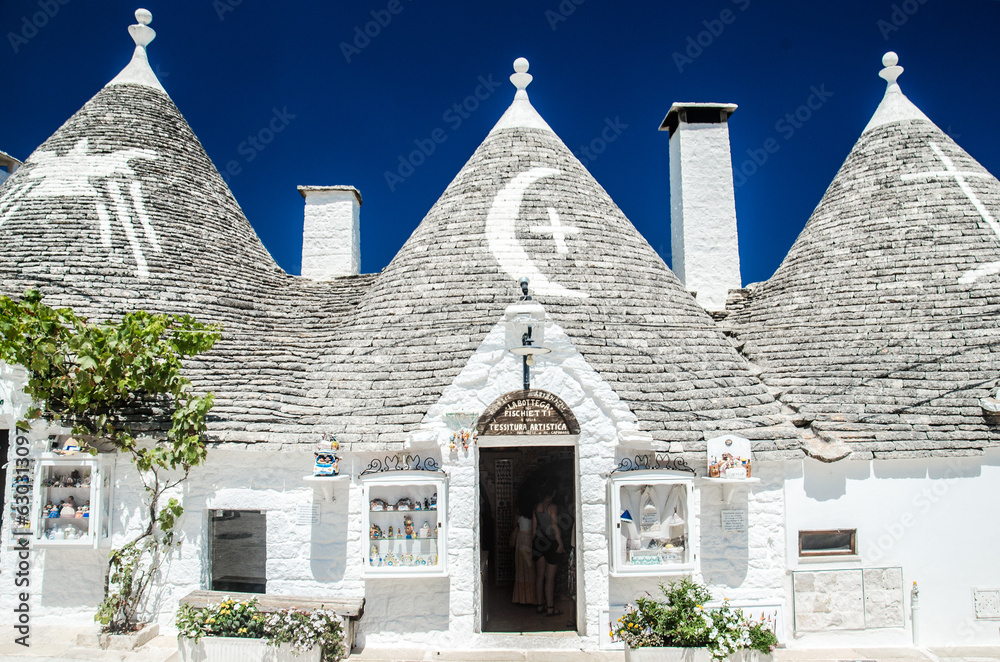 Alberobello, Italy, July 29, 2023. Old trulli houses with conical roofs in Alberobello.