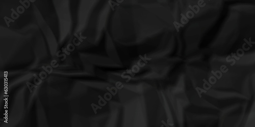Dark crumple black paper wrinkled poster template ,blank glued creased paper texture background. black paper crumled backdrop background. used for cardboard and clarkboard.
