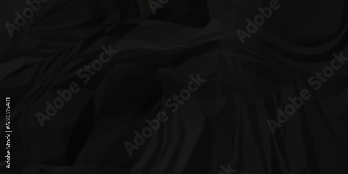 Dark crumple black paper wrinkled poster template ,blank glued creased paper texture background. black paper crumled backdrop background. used for cardboard and clarkboard.