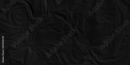 Dark crumple black paper wrinkled poster template ,blank glued creased paper texture background. black paper crumled backdrop background. used for cardboard and clarkboard.