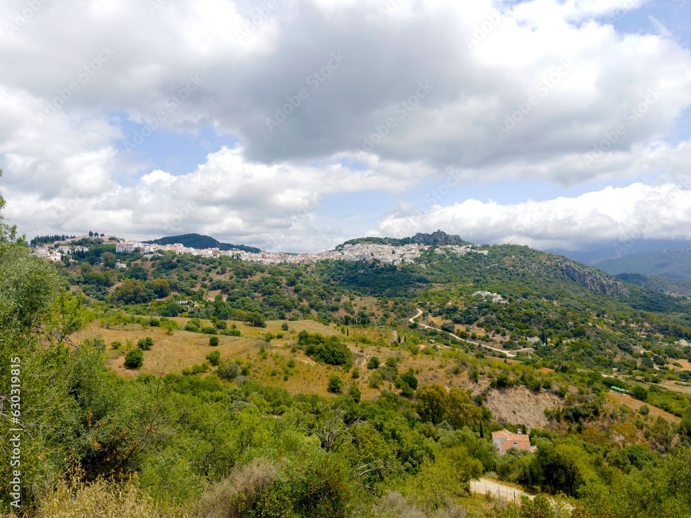 view over the hilly Andalusian landscape to the mountain village Gaucin, Paraje Natural Los Reales de Sierra Bermeja, Estepona, Andalusia, Malaga, Spain