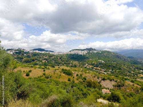 view over the hilly Andalusian landscape to the mountain village Gaucin  Paraje Natural Los Reales de Sierra Bermeja  Estepona  Andalusia  Malaga  Spain