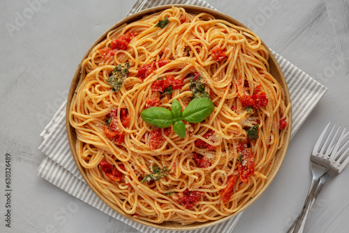 Homemade Spaghetti With Fresh Tomato Sauce on a Plate, top view. Flat lay, from above, overhead.