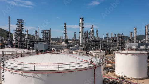 Oil​ and Gas refinery petrochemical​ plant industrial with oil and gas storage tank, White oil and gas refinery storage tank, Aerial view Oil and gas refinery plant from industry zone.