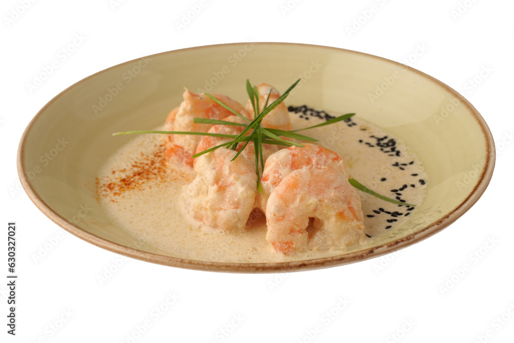 Pre-marinated shrimp in fragrant ginger and Garam Masala, fried in white wine with cream in a light plate on a white background, restaurant dish. Pre-marinated shrimp in fragrant ginger and Garam Masala, fried in white wine with cream in a light plate on a white background, restaurant dish.