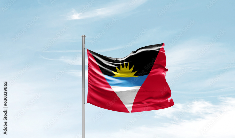 Antigua and Barbuda national flag waving in sky.