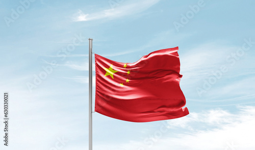 China national flag waving in sky.