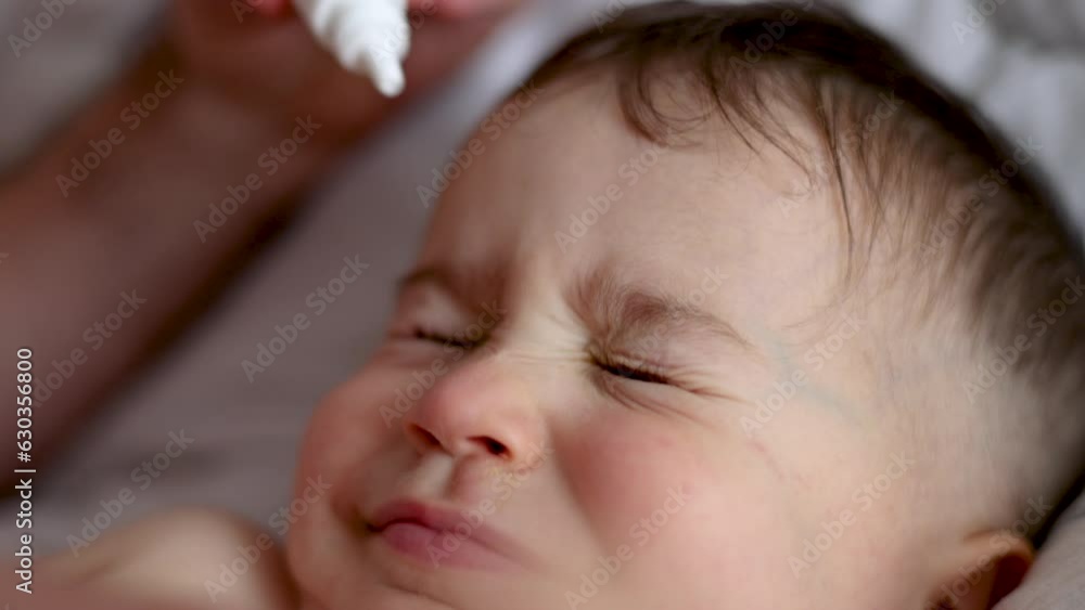 baby kid child boy taking eye drop, conjunctivitis treatment 4k close