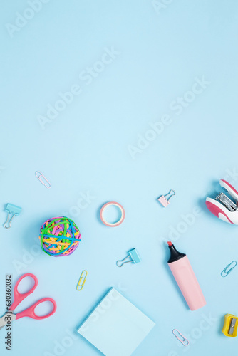 Set of stationery for work and study on blue background. Back to school. Top view, flat lay, copy space