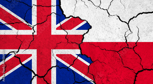 Flags of United Kingdom and Poland on cracked surface - politics, relationship concept